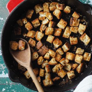 With this skillet croutons recipe, you will not consider store-bought croutons ever again. These are ready in minutes and are much better! Overhead shot of the skillet with the croutons.